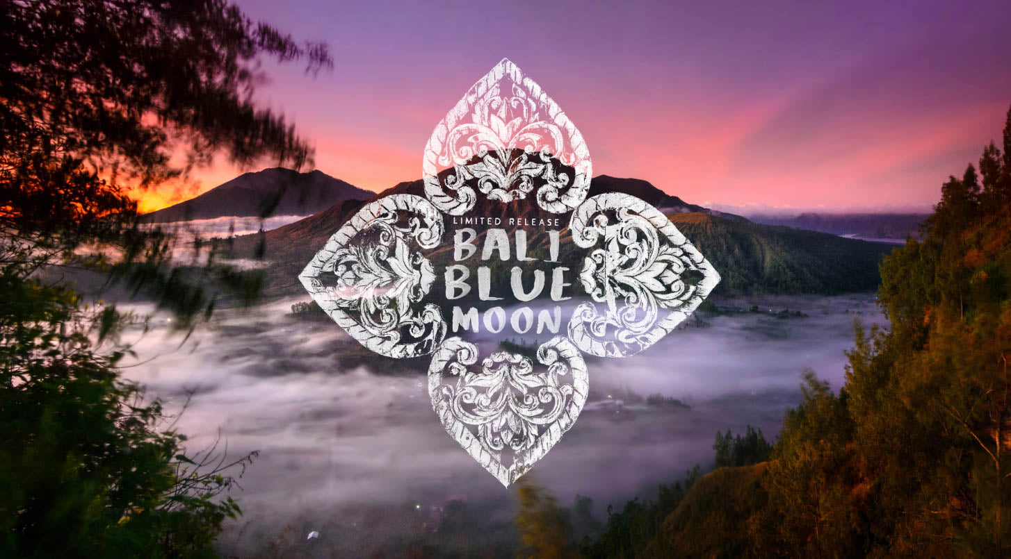 Bali Blue Moon coffee promo with an ornate design over a misty mountain sunrise, highlighting its limited release