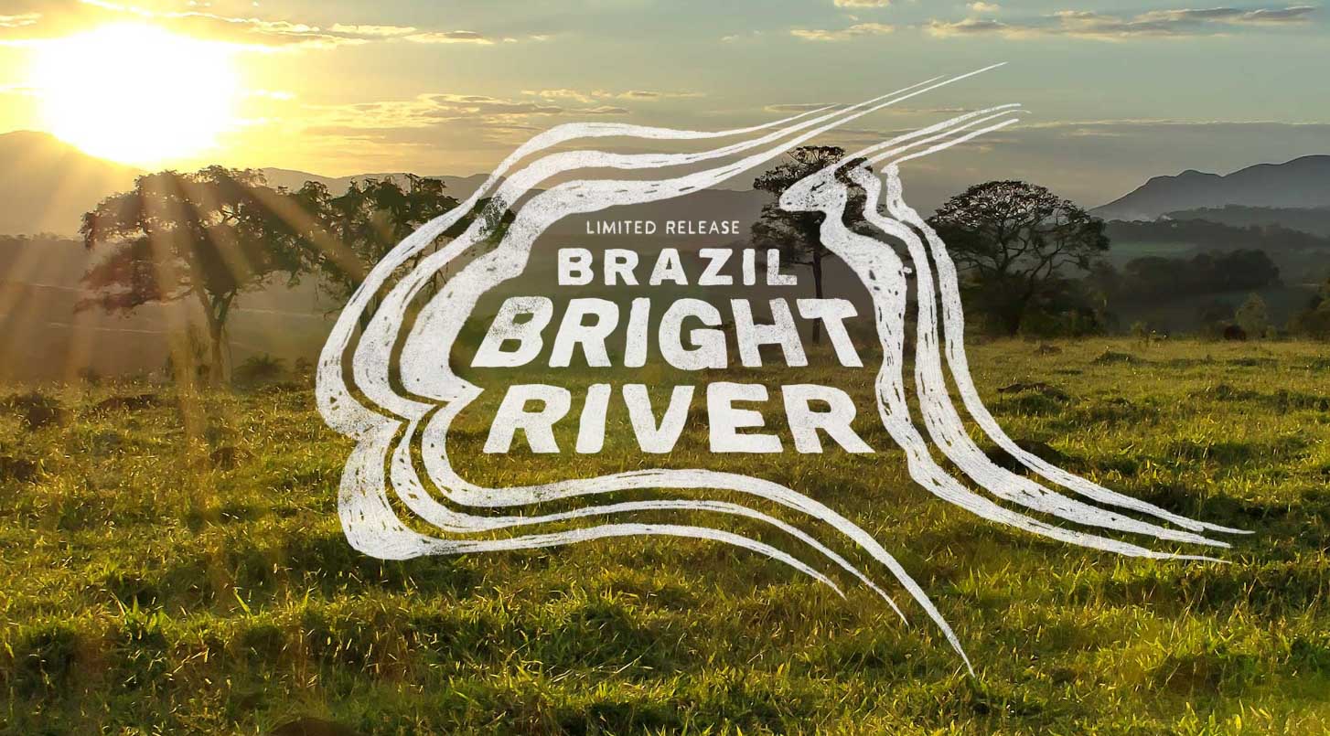 Brazil bright River logo over a sunrise hitting a lightly foggy valley