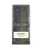 Peet's Coffee Tanzania Peaberry dark roast coffee package on a dark background