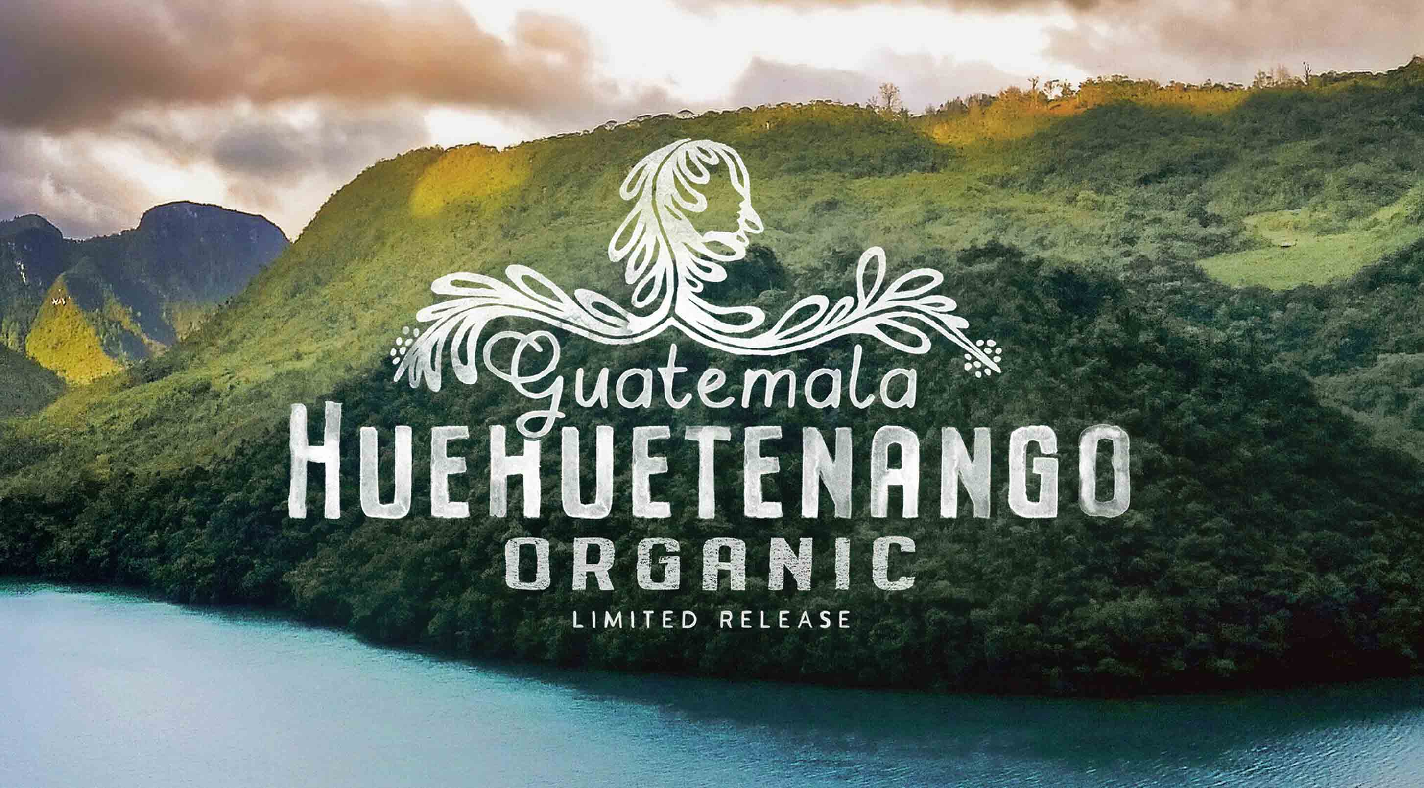 Guatemala Huehuetenango Organic coffee label with a scenic background of mountains and water.