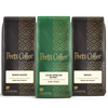 Three Peet's Coffee bags with different blends on a white background