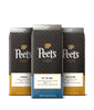 Three Peet's coffee bags with different roast labels on a black background