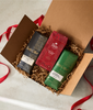 Three Peet's Coffee bars in a decorative box with ribbons on a light background