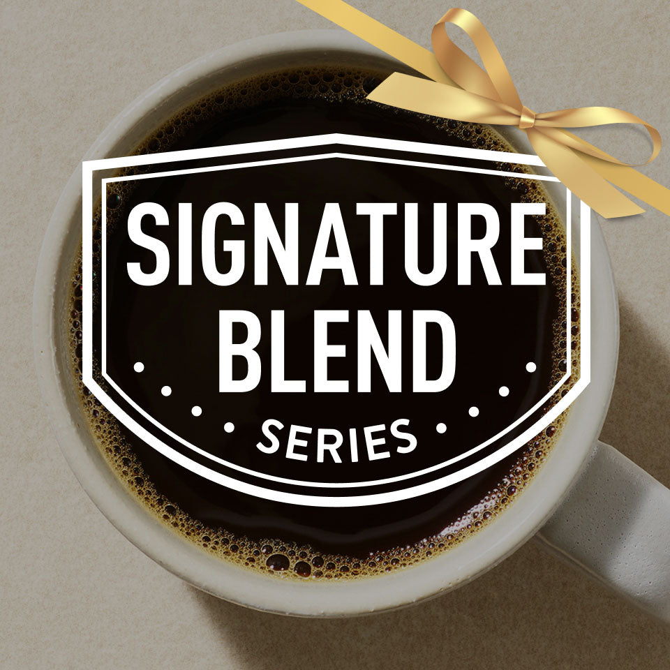 Coffee cup with 'Signature Blend Series' label and gold ribbon on a beige background